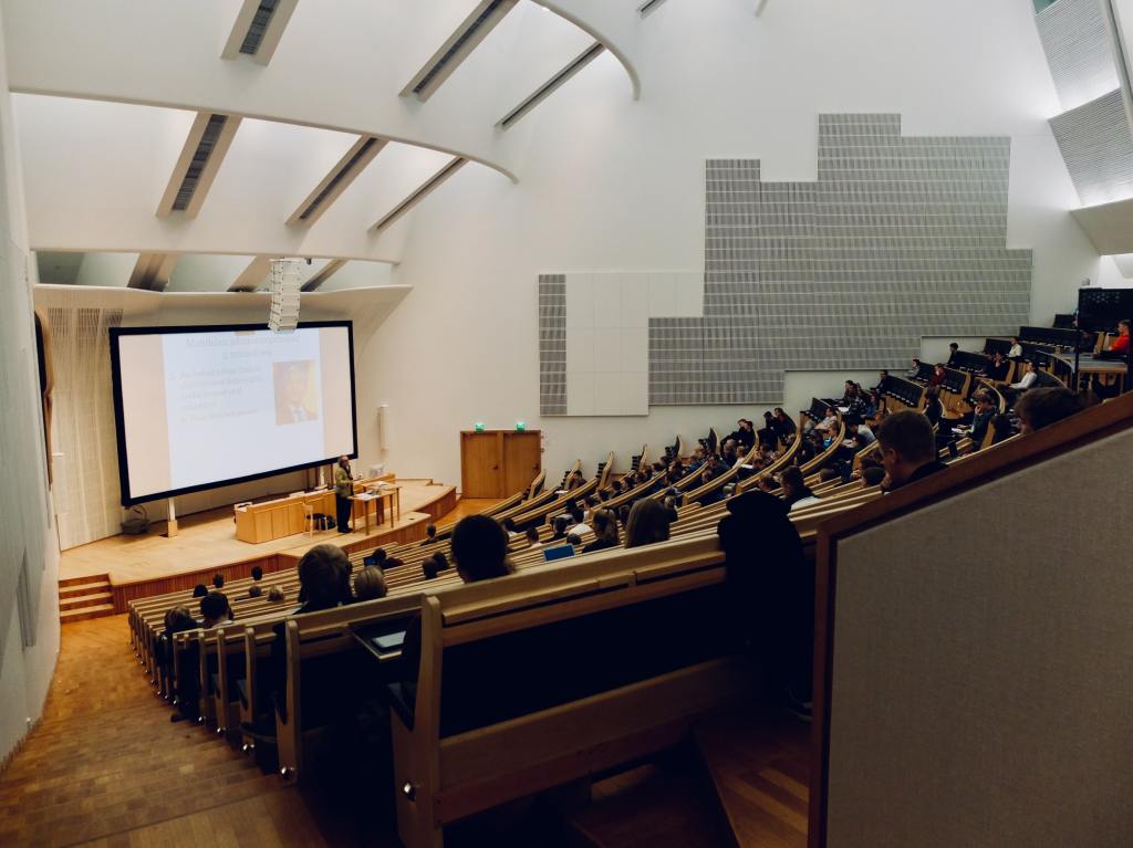 A lecture theatre. One teacher to around 100 students.