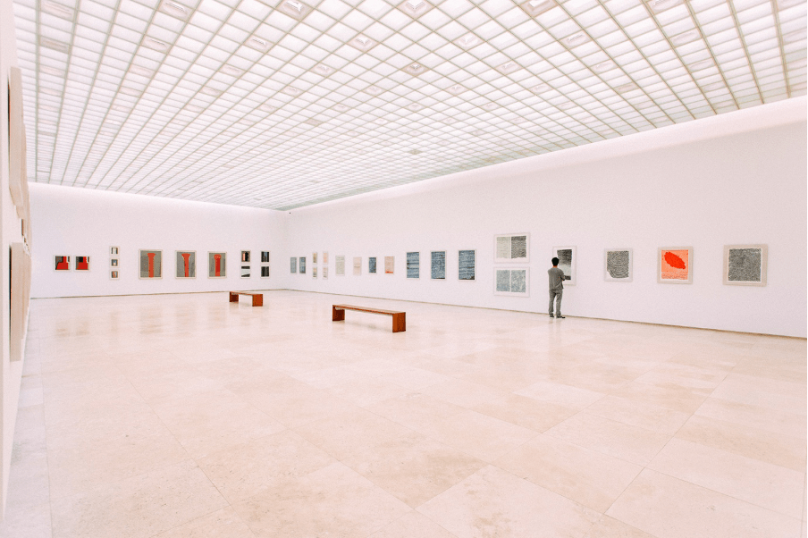 An art gallery, light and airy with a glass ceiling.