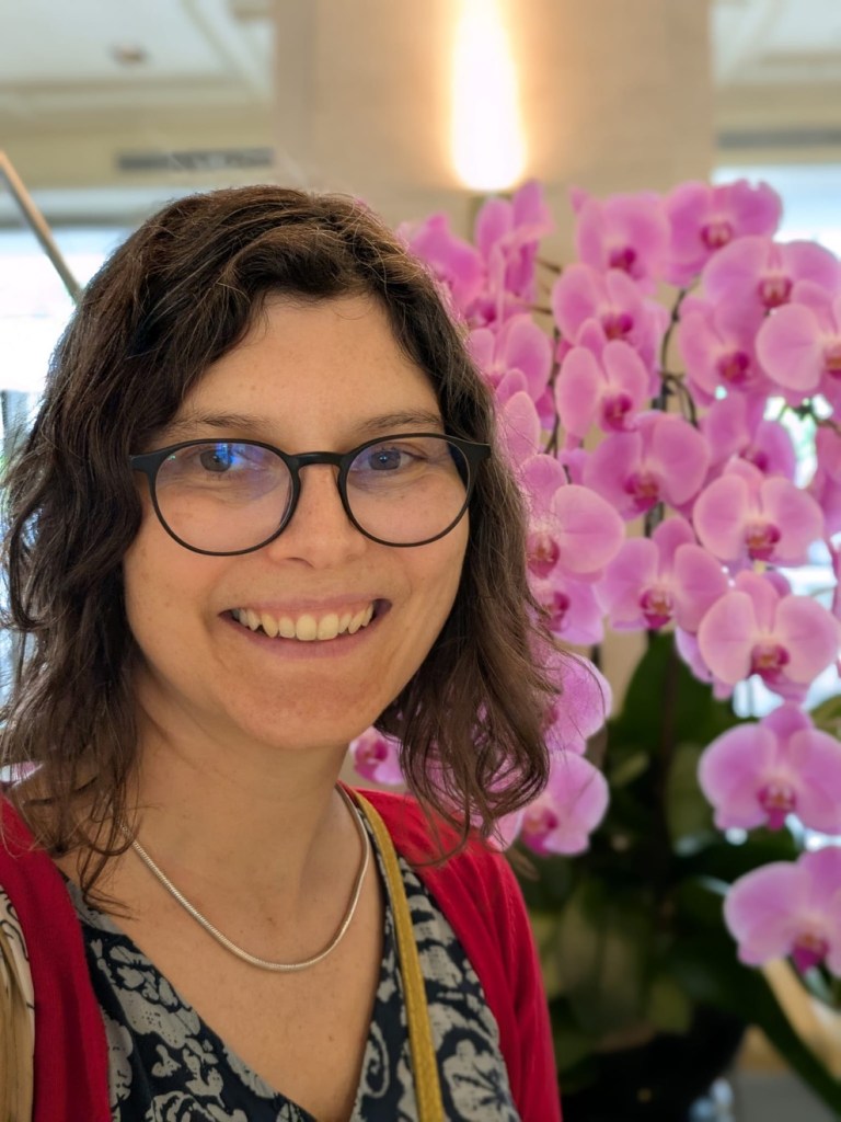 A headshot of Ines and a purple orchid